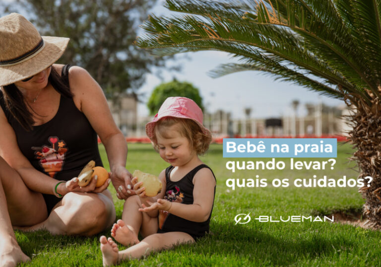 foto de bebe com chapeu e maiô e praia