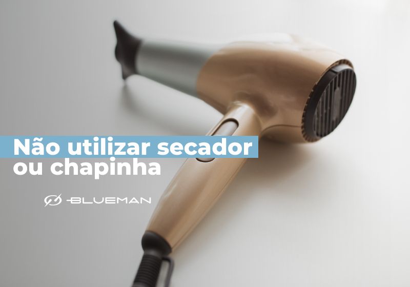 nao utilize secador ou chapinha depois do banho de mar foto de secador e fundo branco