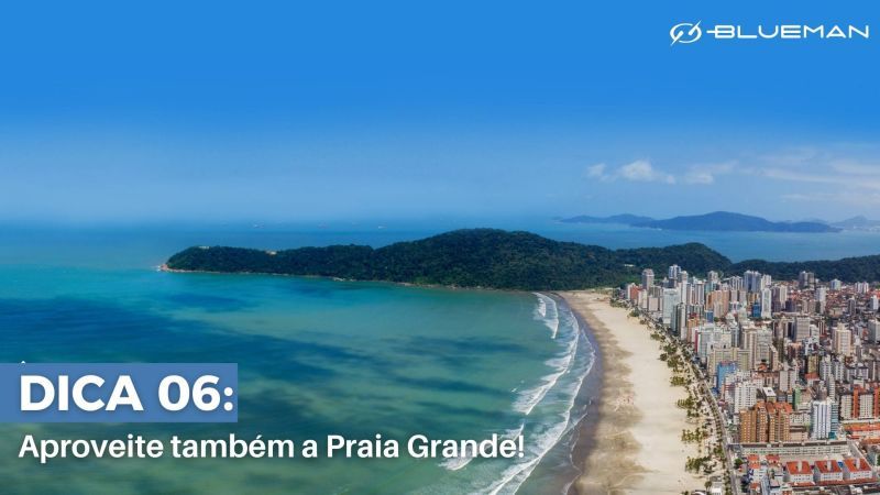 Praia Grande Vista aérea de cidade costeira com bastante prédio e mar.